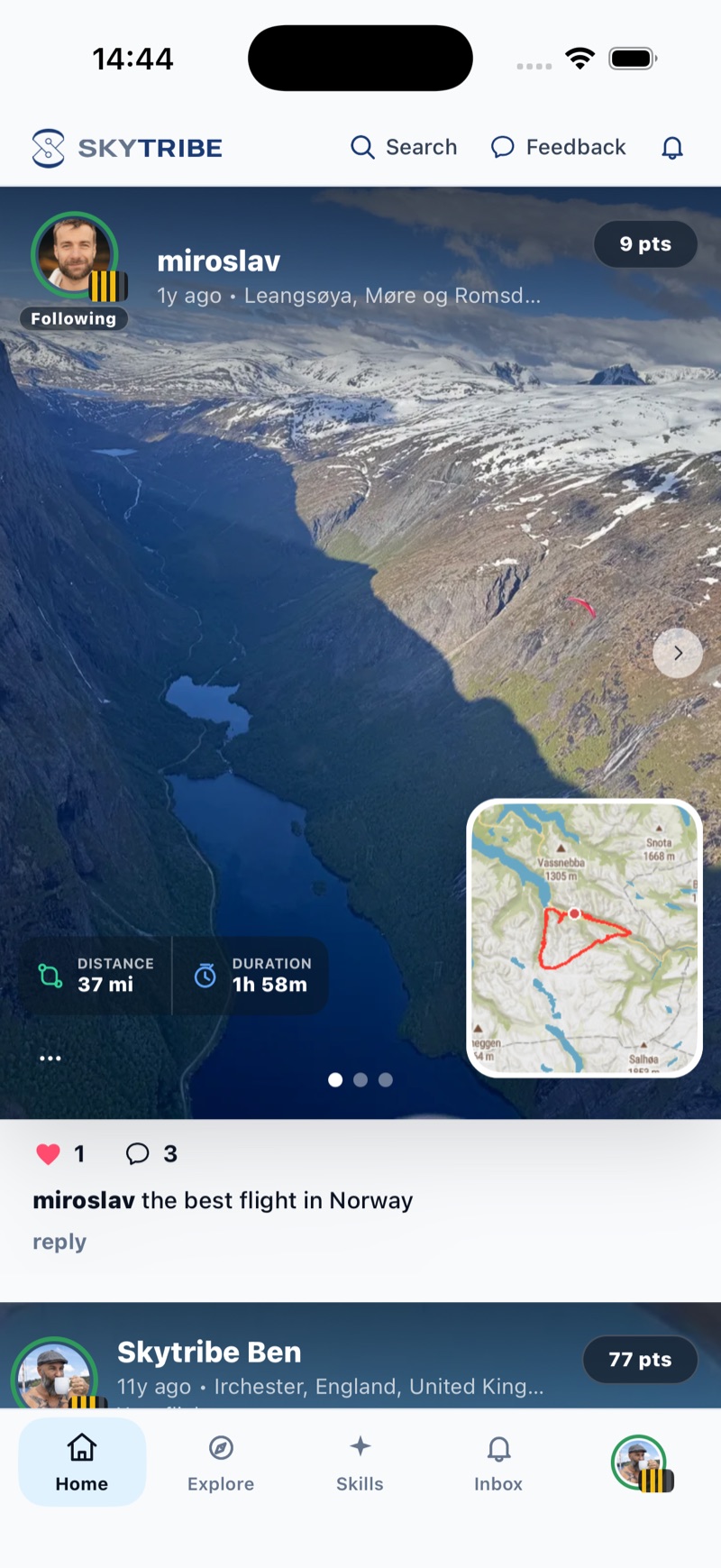 SkyTribe home feed: a flight card from miroslav at Leangsøya in Møre og Romsdal, Norway, a photo from the seat looking down a deep fjord with snow-capped mountains and a paramotor wing tiny against the rock wall, a red triangular track on a map inset, 37 miles and 1 hour 58 minutes, a Following pill and three stripes beside his avatar, one like and three comments, and his comment the best flight in Norway